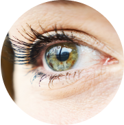 Closeup shot of a green eye experiencing dry eye, looking to the distance