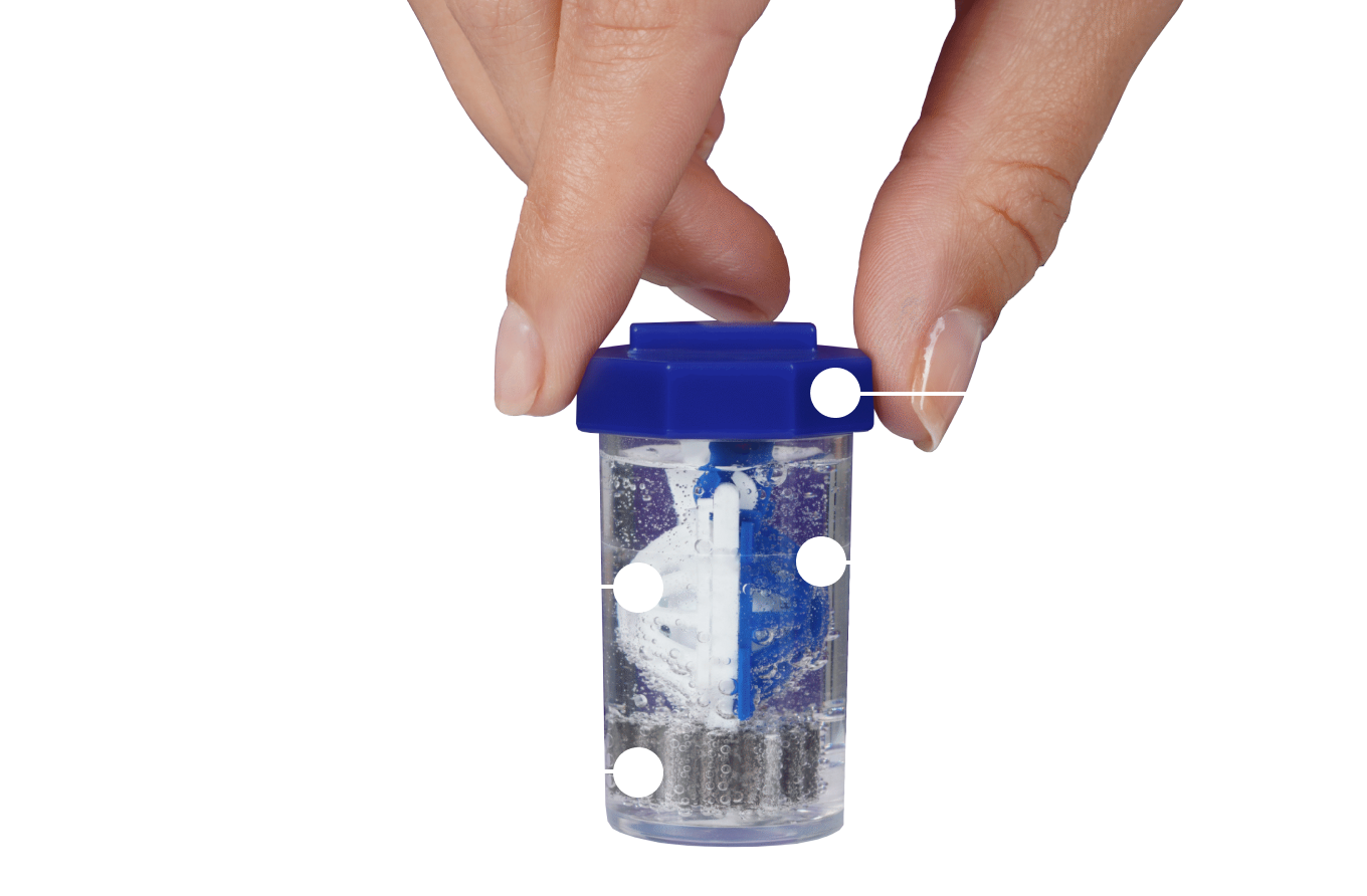 hand screwing the lid of contact lens case into place submerging basket in bubbling hydrogen peroxide contact solution liquid