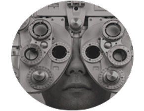 A close-up view of a person undergoing an eye exam using a phoropter, a diagnostic device for measuring refractive error and determining lens prescriptions.