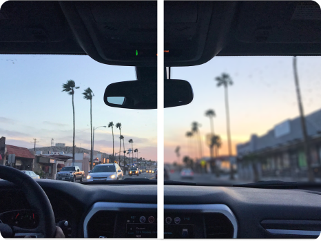 A split-view image illustrating a vision correction comparison showing a driver's perspective of a city street lined with palm trees during sunset. The left side appears slightly blurry or hazy, while the right side is clear and sharp.