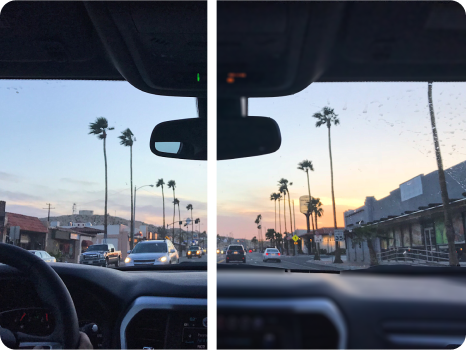 A split-view image illustrating a vision correction comparison showing a driver's perspective of a city street lined with palm trees during sunset. The left side appears slightly blurry or hazy, while the right side is clear and sharp.