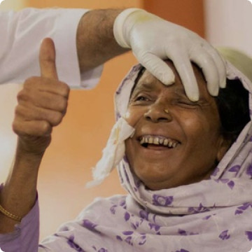 Happy woman receiving eye care