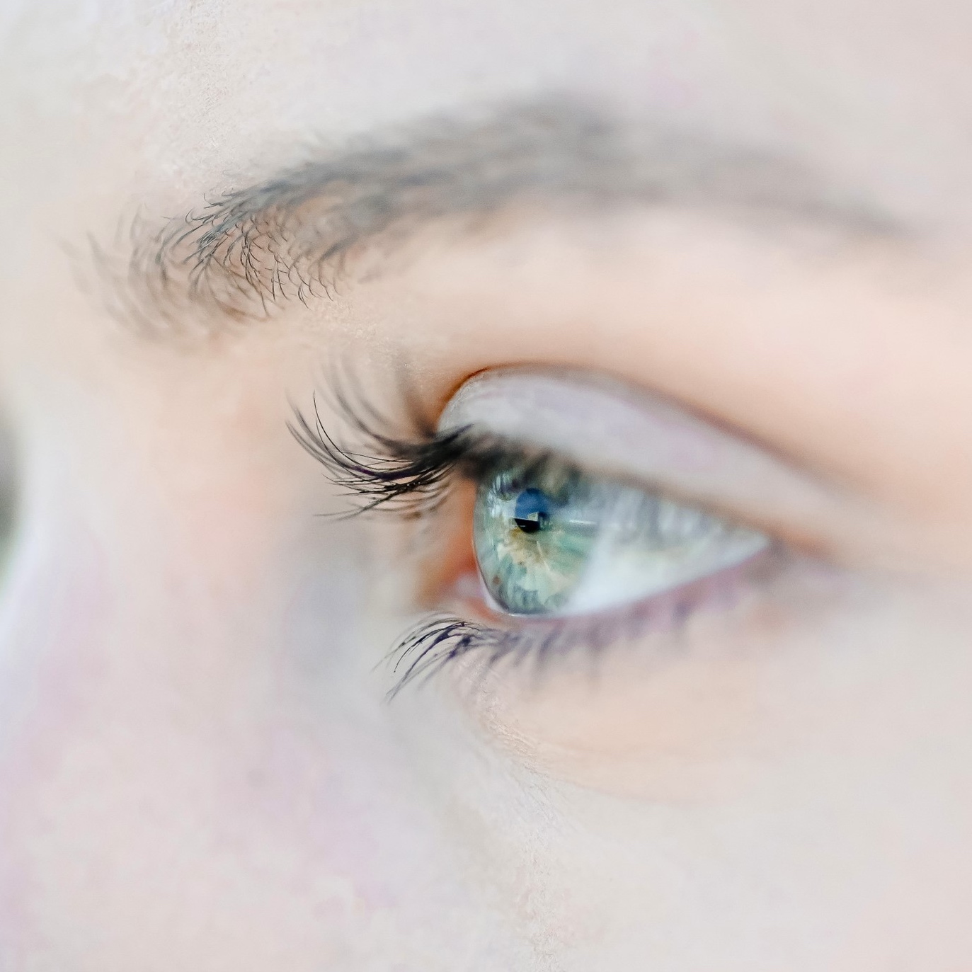 Close-up of a a woman's eye, as she looks to the left.