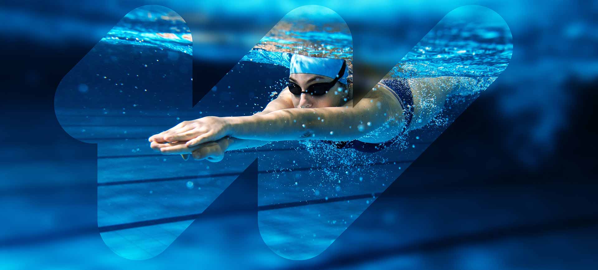 Underwater view of a swimmer gliding forward in a pool