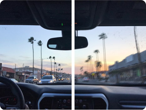 A split-view image illustrating a vision correction comparison showing a driver's perspective of a city street lined with palm trees during sunset. The left side appears slightly blurry or hazy, while the right side is clear and sharp.